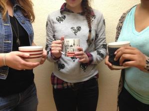 Amberlynn Drewes, Rachel Rizzo, and Shemariah Sweet enjoying cups of coffee 